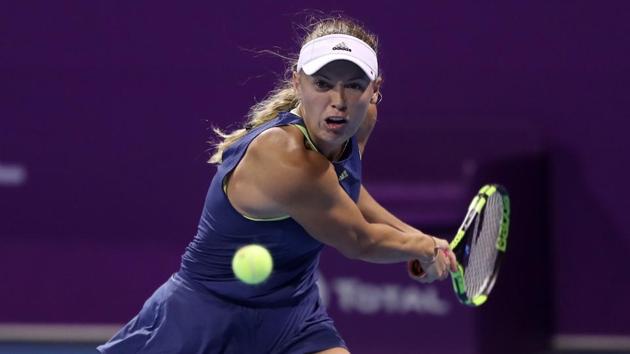 Caroline Wozniacki of Denmark returns the ball to Carina Witthöft of Germany (unseen) during their singles second match at the 2018 WTA Qatar Open in the capital Doha on Thursday. (AFP) Caroline Wozniacki of Denmark returns the ball to Carina Witthöft of Germany (unseen) during their singles second match at the 2018 WTA Qatar Open in the capital Doha on Thursday. (AFP)
