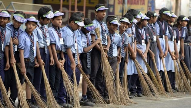 School children stand in a line to take part in the 'Swachh Bharat Abhiyan' cleaning campaign in Hyderabad on February 12. (Noah Seelam / AFP) School children stand in a line to take part in the 'Swachh Bharat Abhiyan' cleaning campaign in Hyderabad on February 12. (Noah Seelam / AFP)