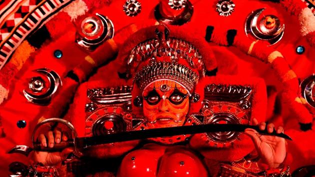 A traditional "Theyyam" dancer from Kerala performs at a tourism promotional event in Bangalore on February 13. (Manjunath Kiran / AFP) A traditional "Theyyam" dancer from Kerala performs at a tourism promotional event in Bangalore on February 13. (Manjunath Kiran / AFP)