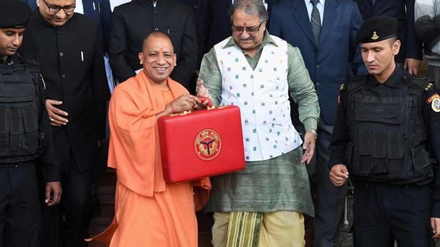 Uttar Pradesh chief minister Yogi Adityanath (left) and UP finance minister Rajesh Agarwal hold a briefcase containing State Budget for 2018-19 ahead of the presentation at Vidhan Sabha in Lucknow on Friday. (PTI) Uttar Pradesh chief minister Yogi Adityanath (left) and UP finance minister Rajesh Agarwal hold a briefcase containing State Budget for 2018-19 ahead of the presentation at Vidhan Sabha in Lucknow on Friday. (PTI)