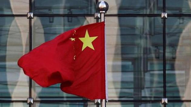 A Chinese national flag at the headquarters of a commercial bank in central Beijing. In January, the country took a total of $704 million worth of new loans, taking foreign borrowings to $6.6 billion in just seven months of this fiscal. (Reuters File Photo) A Chinese national flag at the headquarters of a commercial bank in central Beijing. In January, the country took a total of $704 million worth of new loans, taking foreign borrowings to $6.6 billion in just seven months of this fiscal. (Reuters File Photo)