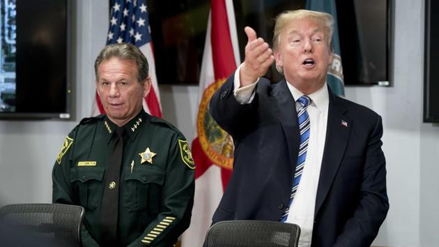 President Donald Trump, accompanied by Broward County Sheriff Scott Israel speaks while meeting with law enforcement officers at Broward County Sheriff's Office in Pompano Beach, Florida.(AP Photo)