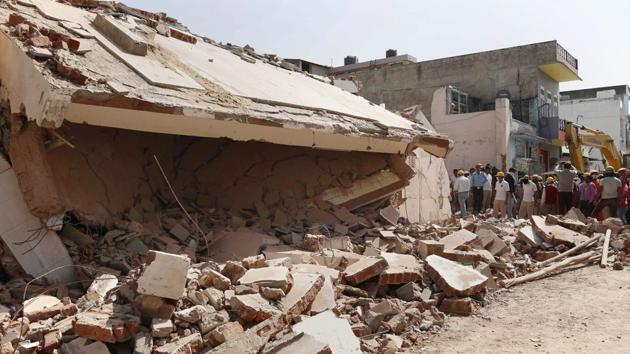 NDRF and SDRF personnel carry out rescue work after collapse of a building due to a gas cylinder blast in Beawar, Rajasthan on Saturday. (PTI) NDRF and SDRF personnel carry out rescue work after collapse of a building due to a gas cylinder blast in Beawar, Rajasthan on Saturday. (PTI)