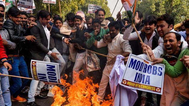 Supporters of the Congress Party shout slogans as they burn effigy of billionaire jeweller Nirav Modi in New Delhi on Friday. (AFP photo) Supporters of the Congress Party shout slogans as they burn effigy of billionaire jeweller Nirav Modi in New Delhi on Friday. (AFP photo)