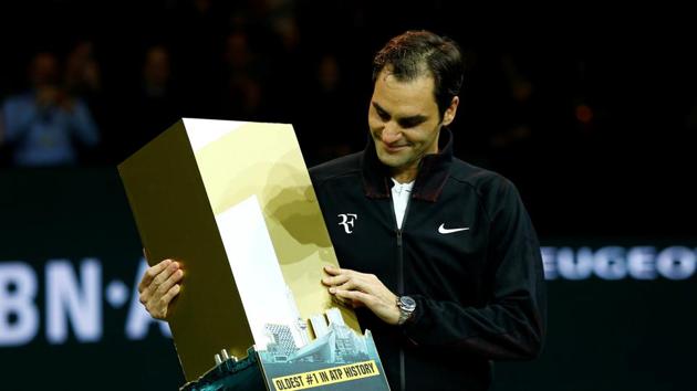 Roger Federer of Switzerland celebrates regaining the world number 1 ranking after defeating Robin Haase of the Netherlands in the Rotterdam Open quarters.(REUTERS)