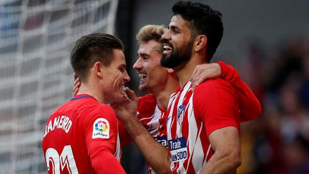 Atletico Madrid's Diego Costa celebrates scoring their second goal with Antoine Griezmann and Kevin Gameiro during the La Liga match vs Athletic Bilbao on Sunday. (REUTERS) Atletico Madrid's Diego Costa celebrates scoring their second goal with Antoine Griezmann and Kevin Gameiro during the La Liga match vs Athletic Bilbao on Sunday. (REUTERS)