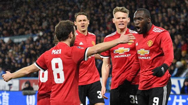 Manchester United's Belgian striker Romelu Lukaku (R) celebrates with teammates after scoring the opening goal during the English FA Cup fifth round football match between Huddersfield Town and Manchester United at the John Smith's stadium in Huddersfield, northern England on Saturday. (AFP) Manchester United's Belgian striker Romelu Lukaku (R) celebrates with teammates after scoring the opening goal during the English FA Cup fifth round football match between Huddersfield Town and Manchester United at the John Smith's stadium in Huddersfield, northern England on Saturday. (AFP)