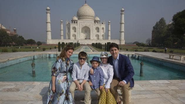 Canadian Prime Minister Justin Trudeau, his wife, Sophie Gregoire Trudeau, their sons Hadrien and Xavier, daughter Ella-Grace, second right, pose for the photographs in front of Taj Mahal, in Agra, India, Sunday, Feb. 18, 2018.(AP)