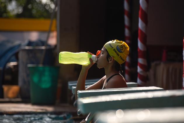 A participant takes a break during the 1st All India Invitation Swimathon organised by Champion Aquatic Club on February 17. (Sanket Wankhade/HT PHOTO)