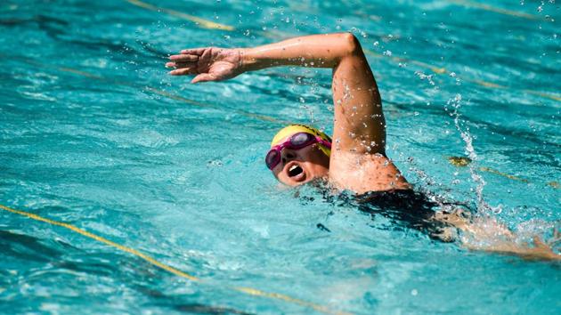 Contestants of the 1st All India Invitation Swimathon in action at the NG Nande swimming pool at Bal Gandharva Rangamandir on February 17. (Sanket Wankhade/HT PHOTO)