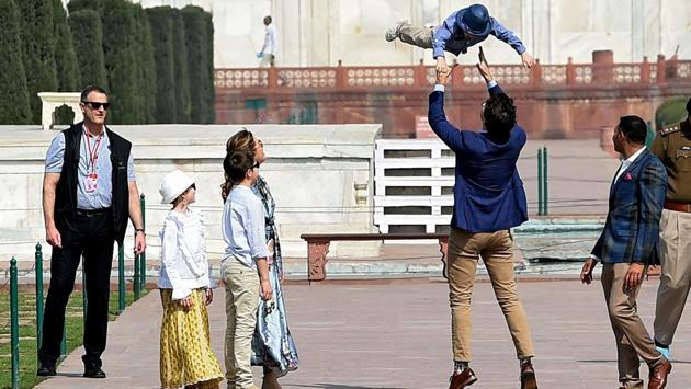 Prime Minister of Canada Justin Trudeau (2R) plays with his son Hadrien while his wife Sophie Gregoire Trudeau and their other two children look on. (Money Sharma / AFP) Prime Minister of Canada Justin Trudeau (2R) plays with his son Hadrien while his wife Sophie Gregoire Trudeau and their other two children look on. (Money Sharma / AFP)
