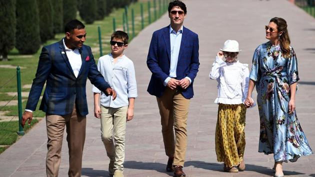 Justin Trudeau (3L), his wife Gregoire Trudeau and their children walk during their visit to the Taj Mahal. Trudeau will also participate in several business roundtables to promote further trade and investment between Canada and India. (Money Sharma / AFP) Justin Trudeau (3L), his wife Gregoire Trudeau and their children walk during their visit to the Taj Mahal. Trudeau will also participate in several business roundtables to promote further trade and investment between Canada and India. (Money Sharma / AFP)