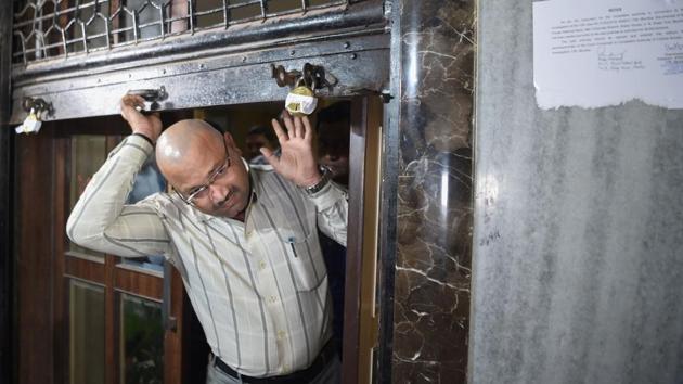 A Central Bureau of Investigation (CBI) official comes out of the sealed Brady House branch of Punjab National Bank (PNB). The CBI on Monday, registered a case against Rotomac Global Pvt. Ltd, its Directors Vikram Kothari, Sadhana Kothari and Rahul Kothari and unknown bank officials on a complaint from the Bank of Baroda. (AFP) A Central Bureau of Investigation (CBI) official comes out of the sealed Brady House branch of Punjab National Bank (PNB). The CBI on Monday, registered a case against Rotomac Global Pvt. Ltd, its Directors Vikram Kothari, Sadhana Kothari and Rahul Kothari and unknown bank officials on a complaint from the Bank of Baroda. (AFP)