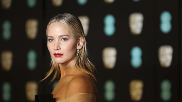 Actress Jennifer Lawrence poses for photographers upon arrival at the BAFTAs.(Vianney Le Caer/Invision/AP)