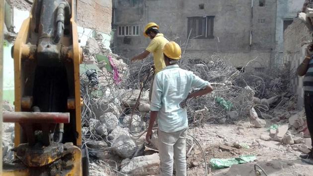 Officials remove debris at the site of cylinder blast in Beawar. (HT Photo) Officials remove debris at the site of cylinder blast in Beawar. (HT Photo)