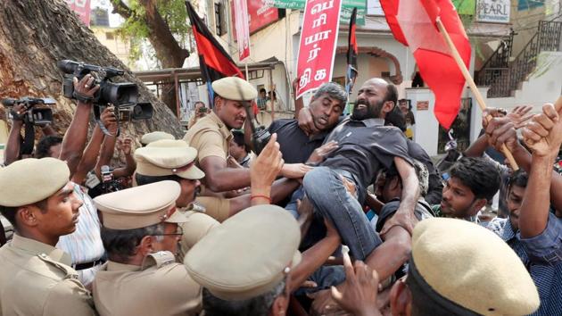 Police personnel in Coimbatore restrain members of Thanthai Periyar Dravida Kalagham who were protesting against the Supreme Court’s order reducing Tamil Nadu’s share in Cauvery waters.(PTI) Police personnel in Coimbatore restrain members of Thanthai Periyar Dravida Kalagham who were protesting against the Supreme Court’s order reducing Tamil Nadu’s share in Cauvery waters.(PTI)