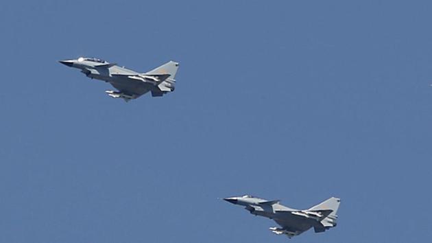 In this September 2015 file photo, two Chinese J-10 fighter jets fly in formation during a parade commemorating the 70th anniversary of Japan's surrender during World War II in Beijing.(AP Photo)