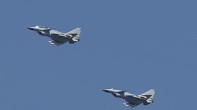 In this September 2015 file photo, two Chinese J-10 fighter jets fly in formation during a parade commemorating the 70th anniversary of Japan's surrender during World War II in Beijing. (AP Photo) In this September 2015 file photo, two Chinese J-10 fighter jets fly in formation during a parade commemorating the 70th anniversary of Japan's surrender during World War II in Beijing. (AP Photo)