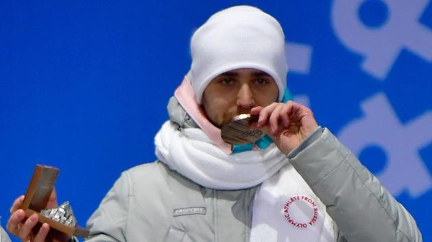Russia's bronze medallist Alexander Krushelnitsky poses on the podium during the medal ceremony for the curling mixed doubles at the 2018 Winter Olympics. (AFP) Russia's bronze medallist Alexander Krushelnitsky poses on the podium during the medal ceremony for the curling mixed doubles at the 2018 Winter Olympics. (AFP)