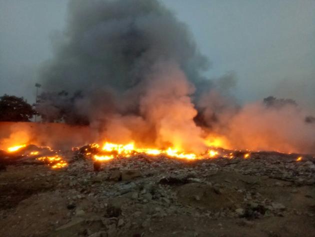 The waste pile that was set on fire had been lying unattended for months on a 6-acre vacant plot belonging to Huda. (HT PHOTO) The waste pile that was set on fire had been lying unattended for months on a 6-acre vacant plot belonging to Huda. (HT PHOTO)