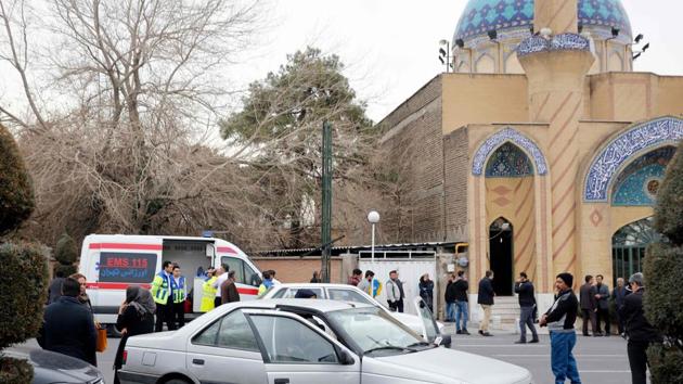 Relatives of Iranian passengers, onboard the Aseman Airlines flight EP3704, line up in front of a mosque near Tehran's Mehrabad airport.  (Atta Kenare / AFP) 