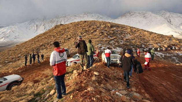 A handout picture released on February 19, 2018 by the Tasnim news agency shows members of a rescue team searching for the wreckage of Aseman Airlines flight EP3704 in Iran's Zagros mountain range. (AFP) A handout picture released on February 19, 2018 by the Tasnim news agency shows members of a rescue team searching for the wreckage of Aseman Airlines flight EP3704 in Iran's Zagros mountain range. (AFP)