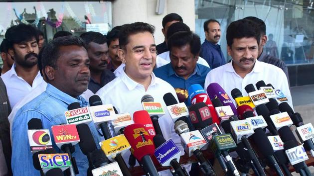 Actor Kamal Haasan addresses the media at the airport in Madurai on Tuesday, a day before he is set to launch his political party.(PTI Photo)
