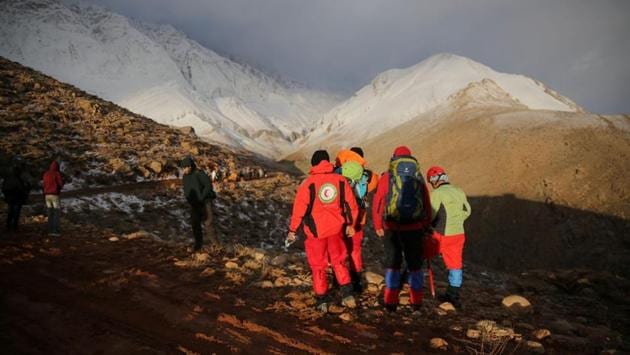 Members of emergency and rescue teams at work on the mountain. “The exact spot of the plane crash was not found, and given the darkness, heavy snowfall and fog in some regions, the aerial search operation was stopped and will be resumed tomorrow,” Esmaeil Najjar, head of Iran’s Crisis Management Organisation, told the ISNA news agency. (Tasnim News Agency / REUTERS) 
