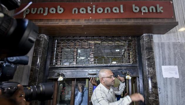 A Central Bureau of Investigation (CBI) official comes out of Mumbai’s Brady House branch of the Punjab National Bank (PNB), which was sealed on Monday.(Kunal Patil/Hindustan Times)