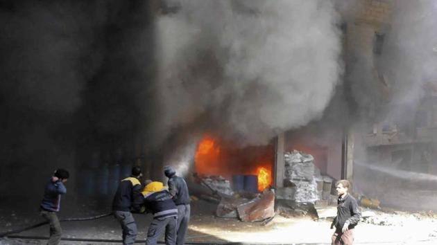 In this photo released on Feb 20, 2018 provided by the Syrian Civil Defense group known as the White Helmets, shows members of the Syrian Civil Defense extinguishing a store during airstrikes and shelling by Syrian government forces, in Ghouta, a suburb of Damascus, Syria. (AP Photo) In this photo released on Feb 20, 2018 provided by the Syrian Civil Defense group known as the White Helmets, shows members of the Syrian Civil Defense extinguishing a store during airstrikes and shelling by Syrian government forces, in Ghouta, a suburb of Damascus, Syria. (AP Photo)