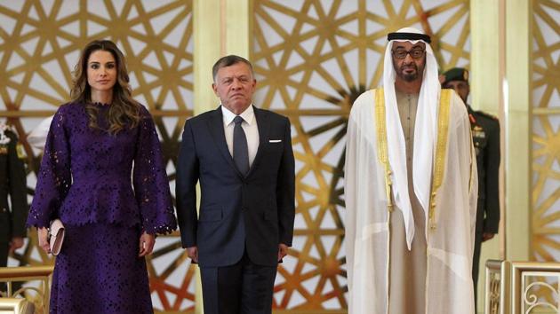 A handout picture released by the Jordanian Royal Palace on February 7, 2018 shows Jordanian King Abdullah II (C) and Queen Rania of Jordan (L) being received by Abu Dhabi Crown Prince Mohammed bin Zayed Al-Nahyan (R) in the capital Abu Dhabi.(AFP Photo)