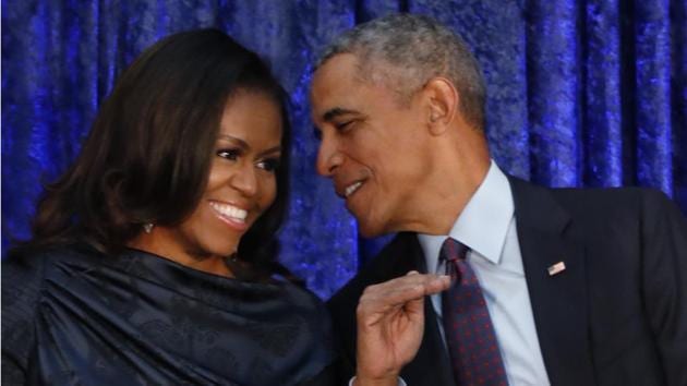 Former US President Barack Obama sits with former first lady Michelle Obama prior to the unveiling of their portraits at the Smithsonian’s National Portrait Gallery in Washington. (REUTERS)
