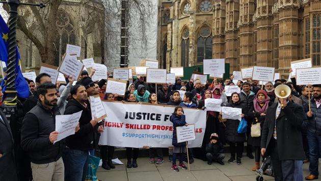 Indian and other non-EU highly skilled professionals protesting outside the British parliament against immigration rules in London on Wednesday.(HT Photo)