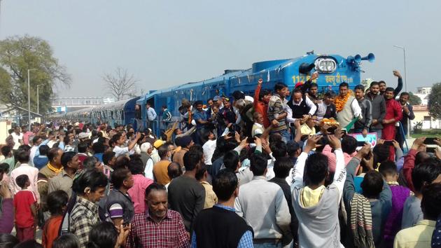 Locals welcome the first train that ran on broad gauge railway track in Khatima. (HT Photo) Locals welcome the first train that ran on broad gauge railway track in Khatima. (HT Photo)
