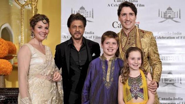 Canadian Prime Minister Justin Trudeau, his wife Sophie Grégoire, daughter Ella-Grace Margaret, son Xavier James pose for a photograph with Shah Rukh Khan in Mumbai on Tuesday.(PTI)