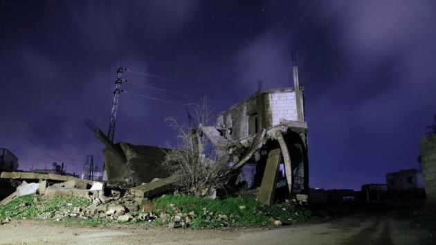 Damaged houses are pictured at night in Daraa, Syria. Held by rebels since 2012, Eastern Ghouta is the last opposition pocket around Damascus and President Bashar al-Assad is keen to retake it with an apparently imminent ground assault. (Alaa Al-Faqir / REUTERS)