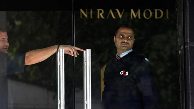 A security guard stands guard inside a Nirav Modi showroom during a raid by Enforcement Directorate.(Reuters File Photo) A security guard stands guard inside a Nirav Modi showroom during a raid by Enforcement Directorate.(Reuters File Photo)
