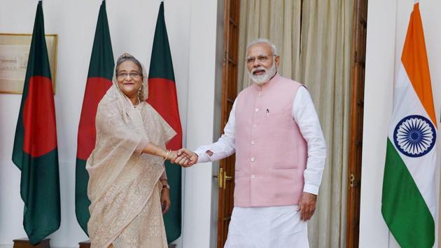 Prime Minister Narendra Modi shakes hands with his Bangladeshi counterpart Sheikh Hasina before a meeting at Hyderabad house in New Delhi.(PTI File Photo)
