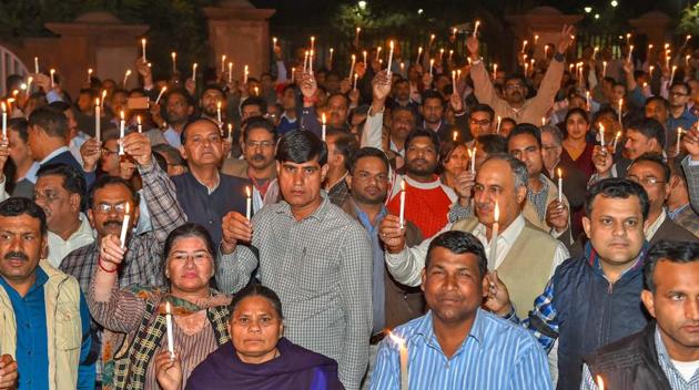 IAS officers and government officials take part in a candle light march protesting the alleged manhandling of Delhi chief secretary Anshu Prakash by AAP MLAs, at Rajghat in New Delhi on Tuesday. (PTI) IAS officers and government officials take part in a candle light march protesting the alleged manhandling of Delhi chief secretary Anshu Prakash by AAP MLAs, at Rajghat in New Delhi on Tuesday. (PTI)