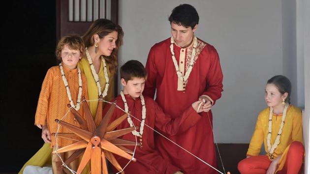 Canadian Prime Minister Justin Trudeau along with his family spins cotton on a traditional 'charkha' in Sabarmati Ashram, Ahmedabad, February 19 (PTI) Canadian Prime Minister Justin Trudeau along with his family spins cotton on a traditional 'charkha' in Sabarmati Ashram, Ahmedabad, February 19 (PTI)