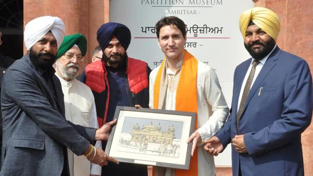 Canadian Prime Minister Justin Trudeau being honoured by Union minister of state for housing and urban affairs Hardeep Singh Puri (2L), Punjab local bodies minister Navjot Singh Sidhu (C), MP Gurjeet Singh Aujla (R) and Amritsar mayor Karamjit Singh Rintu (L), during his visit to Partition Museum at town hall in Amritsar on Wednesday. (HT Photo) Canadian Prime Minister Justin Trudeau being honoured by Union minister of state for housing and urban affairs Hardeep Singh Puri (2L), Punjab local bodies minister Navjot Singh Sidhu (C), MP Gurjeet Singh Aujla (R) and Amritsar mayor Karamjit Singh Rintu (L), during his visit to Partition Museum at town hall in Amritsar on Wednesday. (HT Photo)