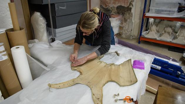 Among the details discovered during conservation work is that the boning finishes slightly lower on the right-hand side, allowing right-handed Elizabeth greater ease of movement. (Leon Neal / Getty Images) 