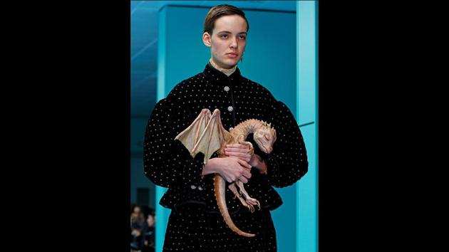 A man in a long black skirt and jacket covered with crystals, carried a pet dragon made of plastic during the show. A style note said that different designs embodied Gucci’s concept of “pluriverse” and drew inspiration from Donna Haraway’s “Cyborg Manifesto,” a 1984 essay rejecting the idea of rigid boundaries, particularly those separating humans from animals and from machines. (Tony Gentile / REUTERS)