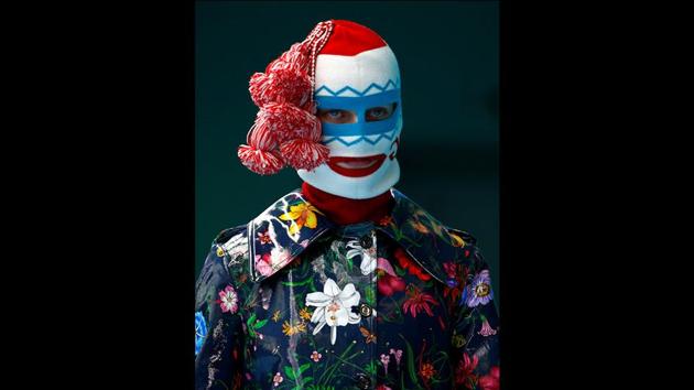 Many models were covered in elaborate headpieces to the tips of their bejewelled toes in a seeming effort to hide the person and reveal their character. (Tony Gentile / REUTERS)