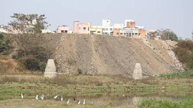 Environmentalists said that rampant dumping of construction debris in river was going unchecked in the city.(HT PHOTO)