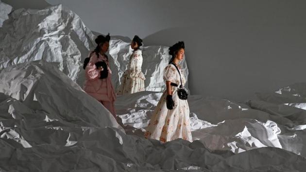 The collection, dubbed Moncler Genius, was unveiled in a series of pavilions each draped in a silvery fabric cast with shimmering lights. Visitors, including super model Naomi Campbell, wandered between each designer’s world. (Tony Gentile / REUTERS)