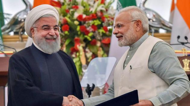 Prime Minister Narendra Modi with Iranian president Hassan Rouhani at the release of a postal stamp commemorating growing economic and trade ties between the two countries, at Hyderabad House in New Delhi on Saturday.(PTI Photo)