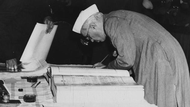 Jawaharlal Nehru signs the Constitution on 24 January 1950.(Photo Division / PIB)