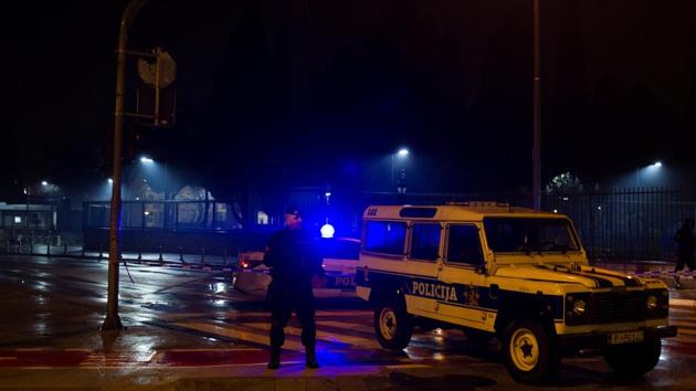 Police guard the entrance to the United States embassy building in Podgorica, Montenegro, on Thursday.(Reuters)