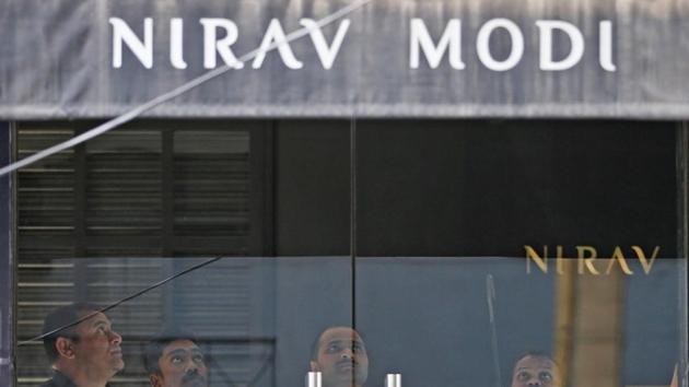Security guards stand inside a Nirav Modi showroom during a raid by the Enforcement Directorate.(Reuters)